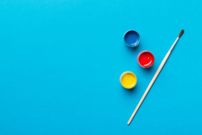 Directly above shot of pills on blue background