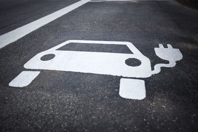 High angle view of arrow sign on road