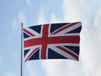 Low angle view of flag against sky