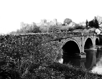 Arch bridge against clear sky