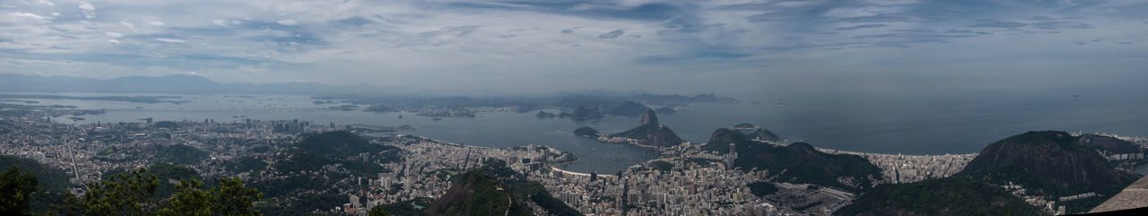 High angle view of trees and mountains against sky