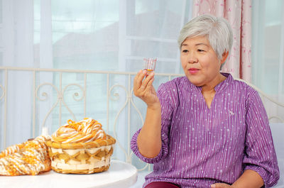 Midsection of woman with ice cream