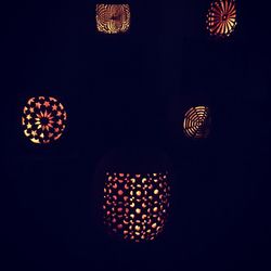 Low angle view of illuminated lanterns at night