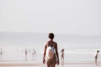 Woman standing on beach