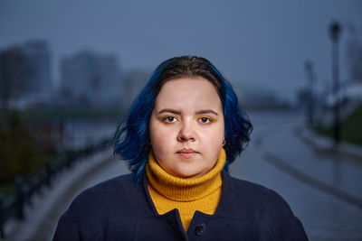 Portrait of woman standing outdoors