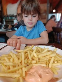 Close-up of girl eating food