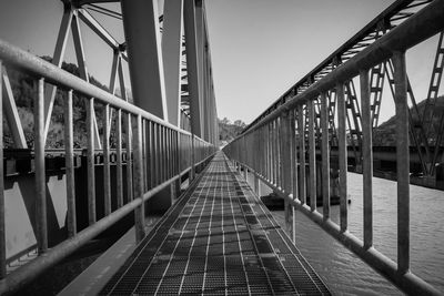 View of footbridge against clear sky