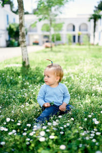 Cute baby girl on field