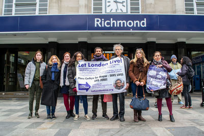 Full length portrait of people standing outdoors