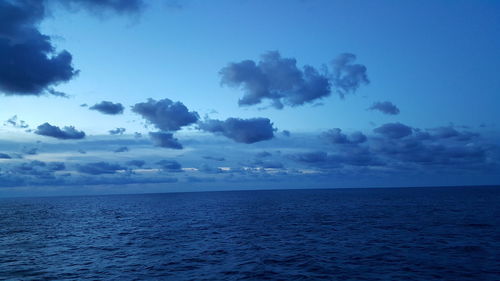 Scenic view of sea against blue sky