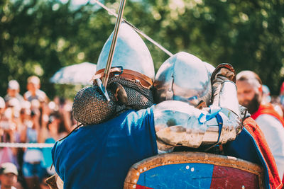 Rear view of people at market stall