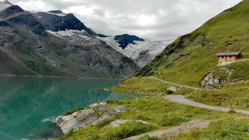 Scenic view of lake and mountains against sky