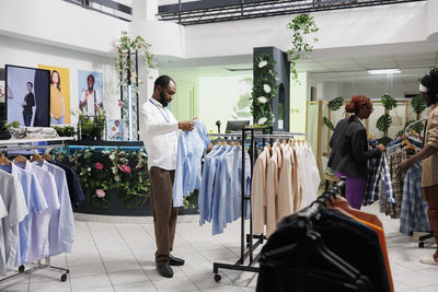 Rear view of woman standing in store