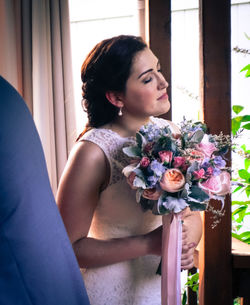 Mid adult woman with flower bouquet