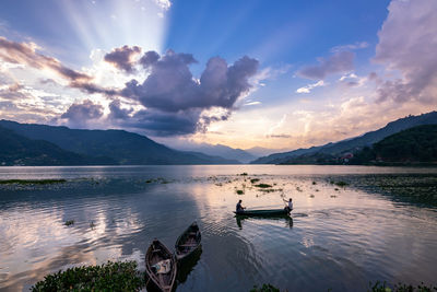 Scenic view of lake against sky during sunset