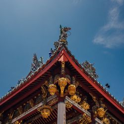 Low angle view of statue of temple against sky