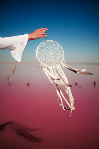 Dream catcher on pink sea, peace and freedom