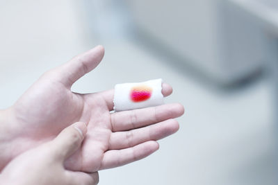 Close-up of hand holding ice cream cone