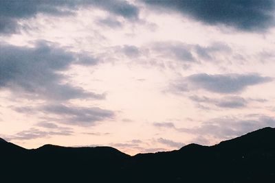 Scenic view of silhouette mountains against sky