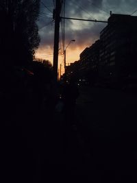 Silhouette of city street at sunset