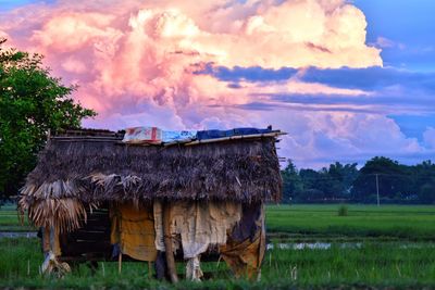 Panoramic view of house on field against sky