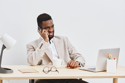 Businesswoman working at desk in office