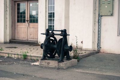 Bicycle on footpath against building