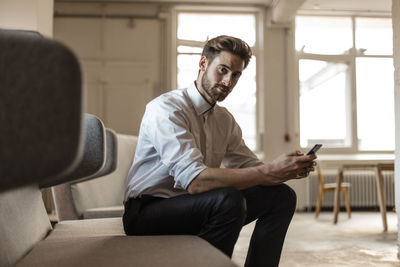 Young man using smart phone