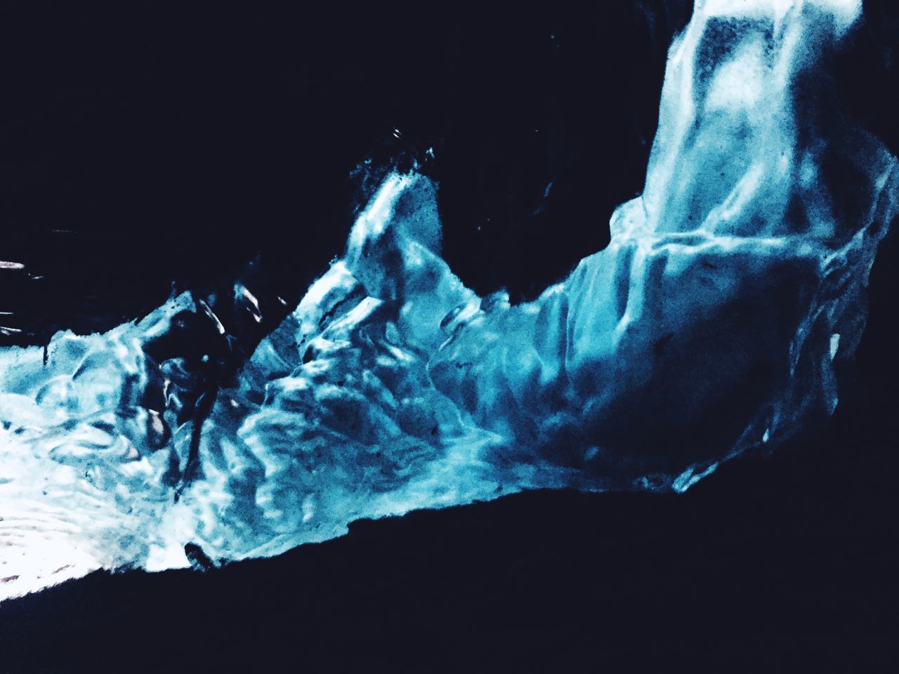 CLOSE-UP OF SNOW AGAINST SKY AT NIGHT