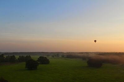 Scenic view of landscape against sky during sunset