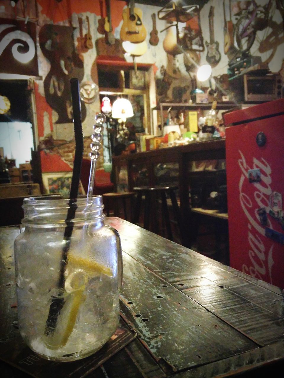 indoors, text, table, close-up, glass - material, western script, still life, no people, communication, reflection, food and drink, water, day, focus on foreground, drink, transparent, drinking glass, incidental people, metal