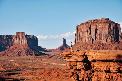 Rock formations on mountain against clear sky