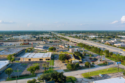 High angle view of city buildings against sky