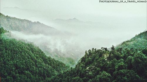 Scenic view of mountains in foggy weather