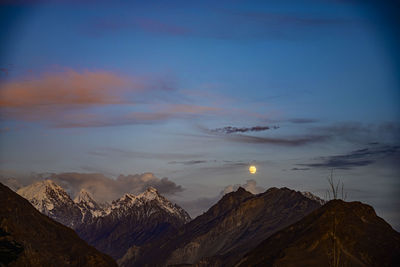 View of snowcapped mountain against cloudy sky