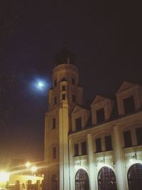 Low angle view of illuminated building at night