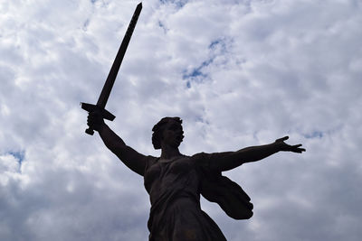 Low angle view of statue against sky