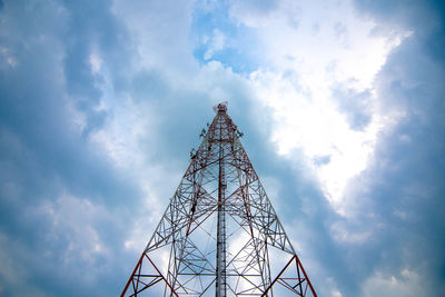 Low angle view of communications tower against sky