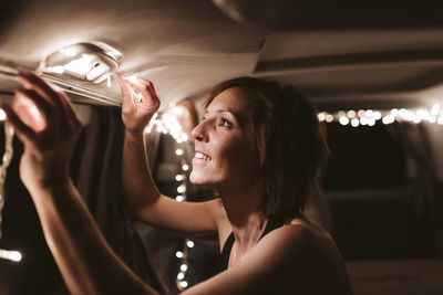 Portrait of young woman holding ice cream