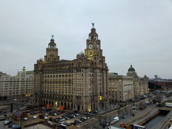 Buildings in city against sky