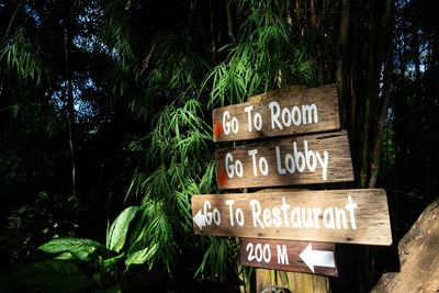 Information sign against trees