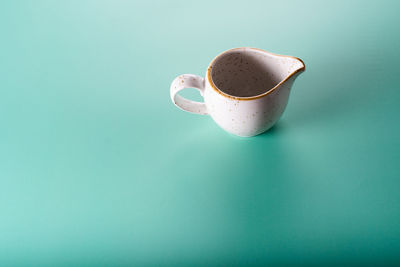 Close-up of coffee cup on table
