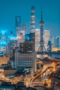 Aerial view of buildings in city at night