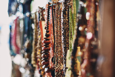 Close-up of clothes hanging in store for sale