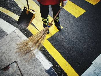 Low section of man walking on street