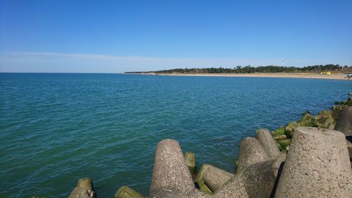 Scenic view of sea against blue sky