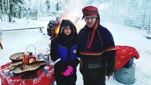 Man and woman in snow during winter
