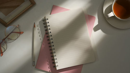 Directly above shot of spiral notebook on table