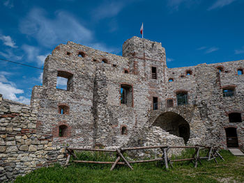 Low angle view of old building against sky