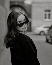 Portrait of young woman wearing sunglasses